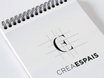 crea-espais-logotipo-inmobiliaria-mustache-agencia